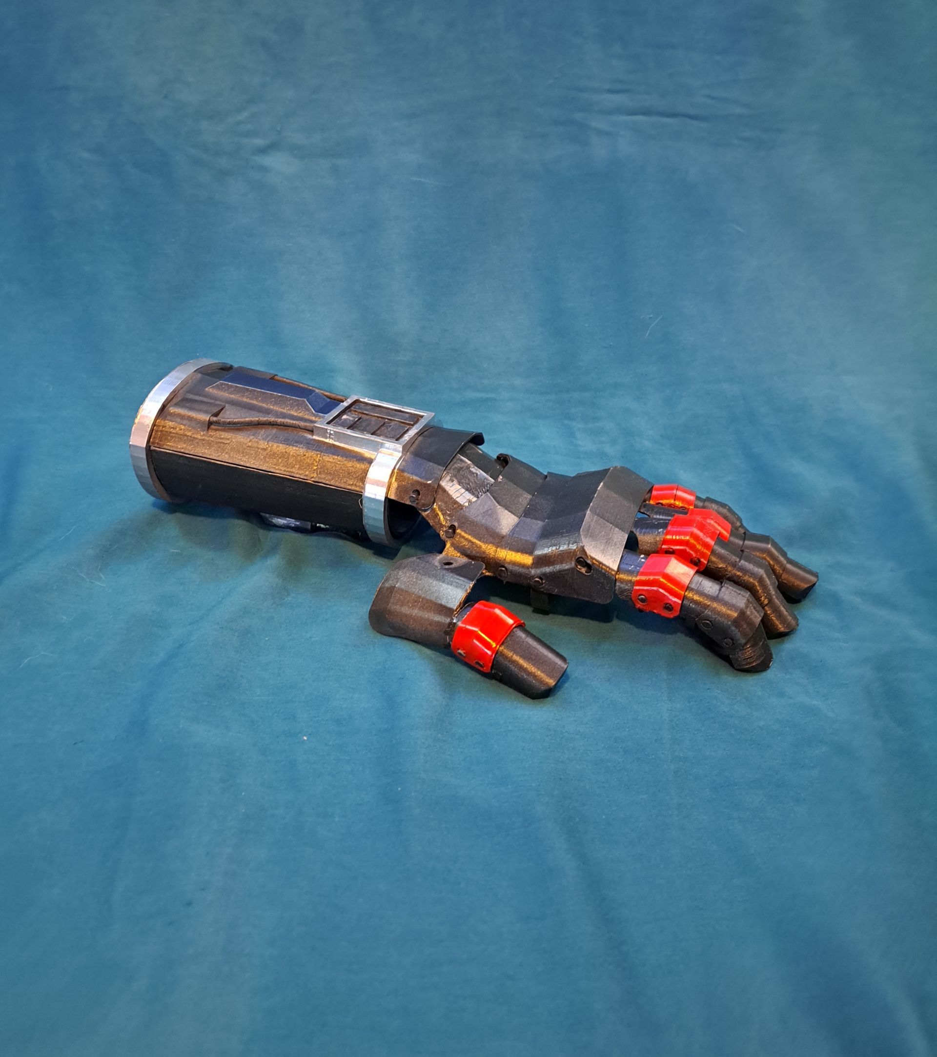 Black and red Mandalorian gauntlet