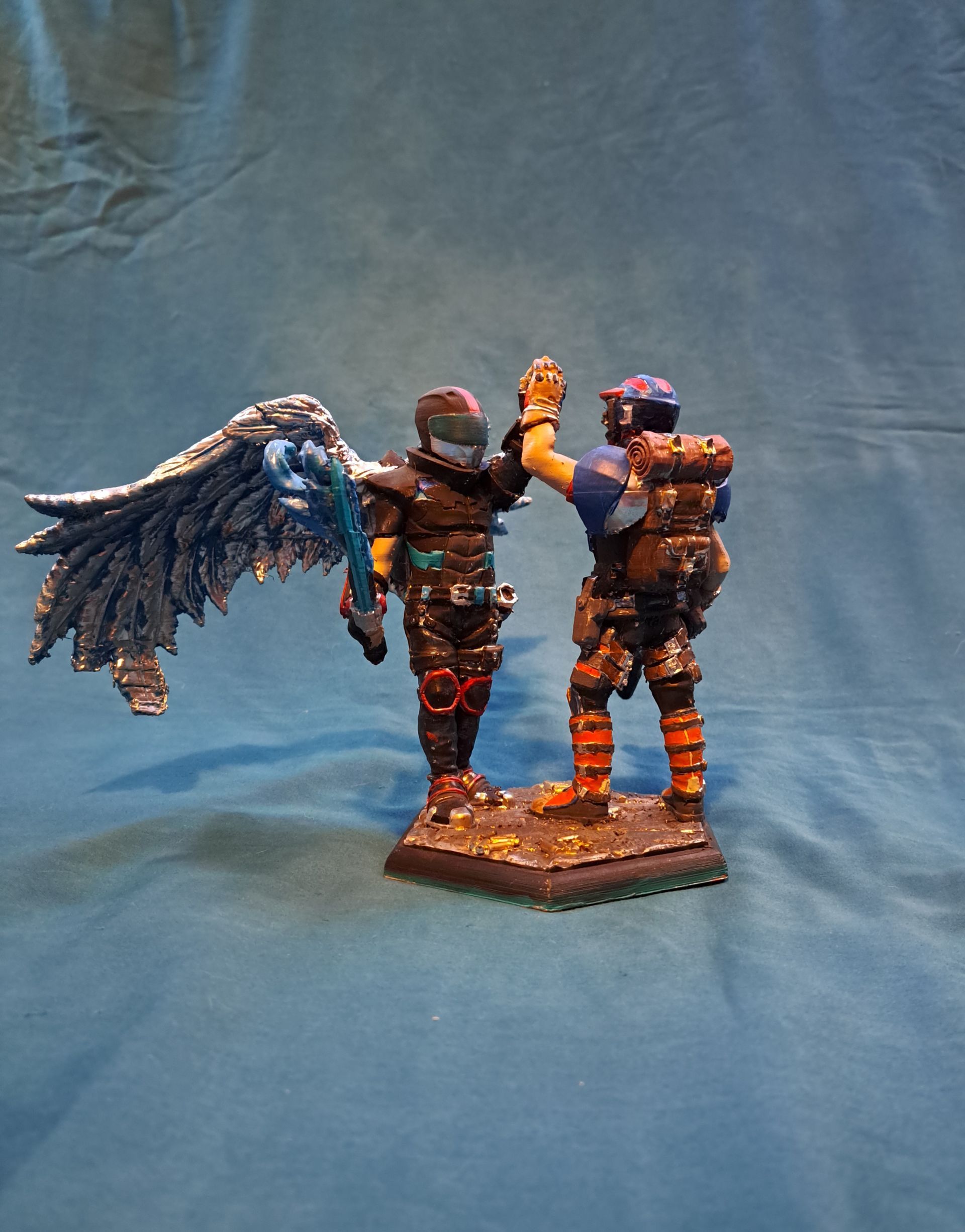 Two figurines high fiving