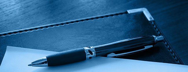 pen laying on a book