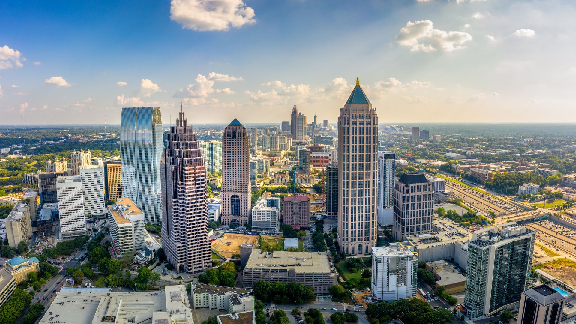 An aerial view of a city skyline with lots of tall buildings.
