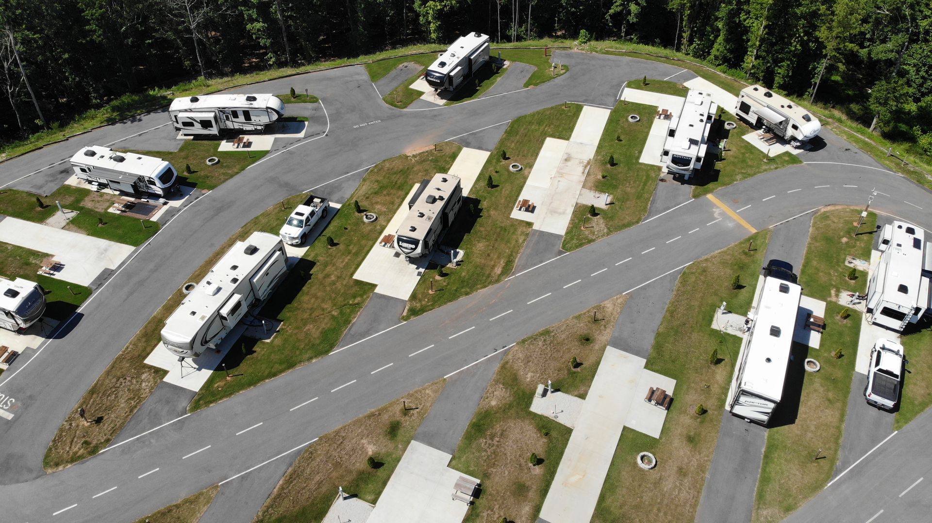 An aerial view of a rv park with a lot of rvs parked in it.