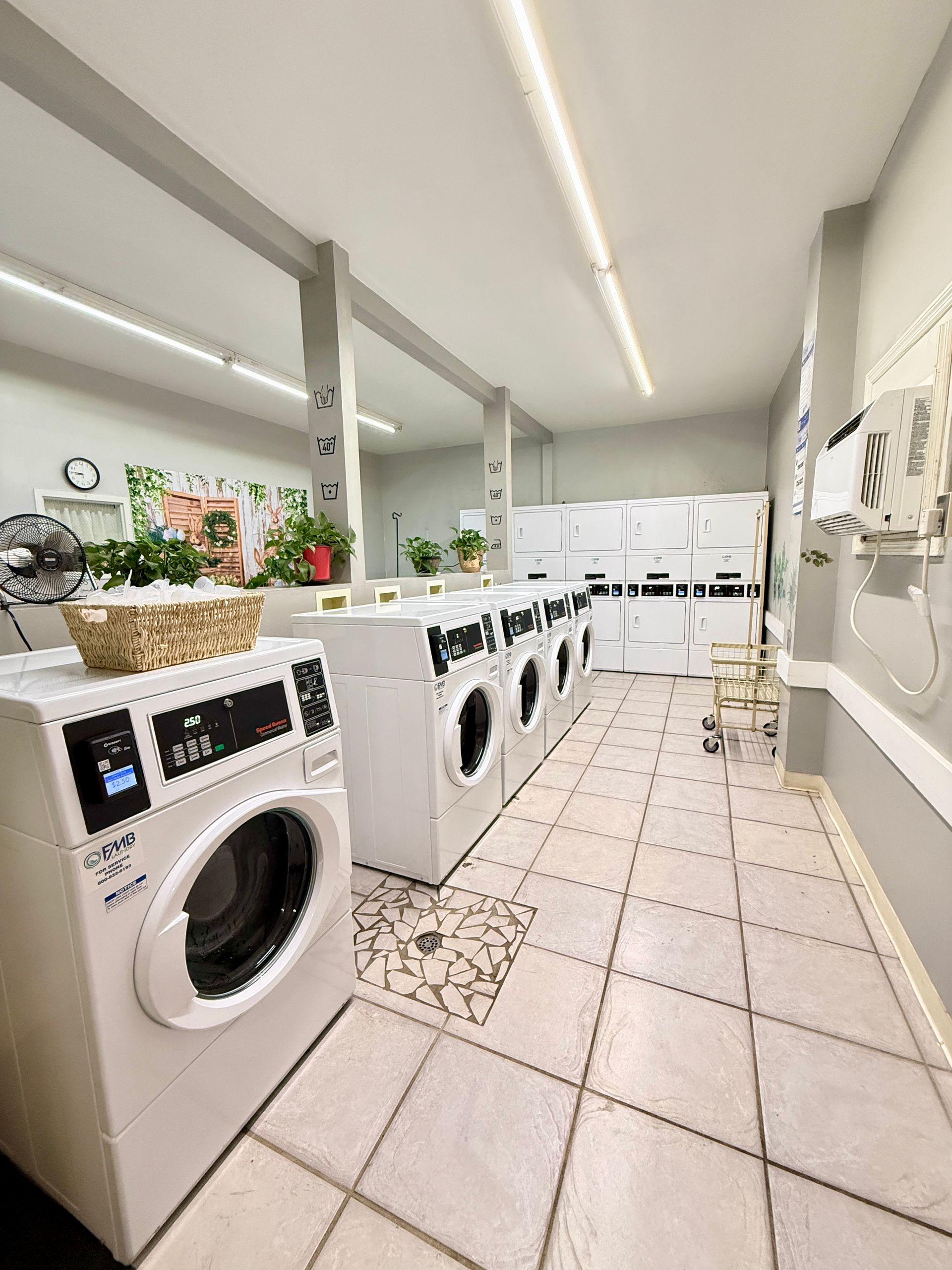 A laundromat with a lot of washers and dryers