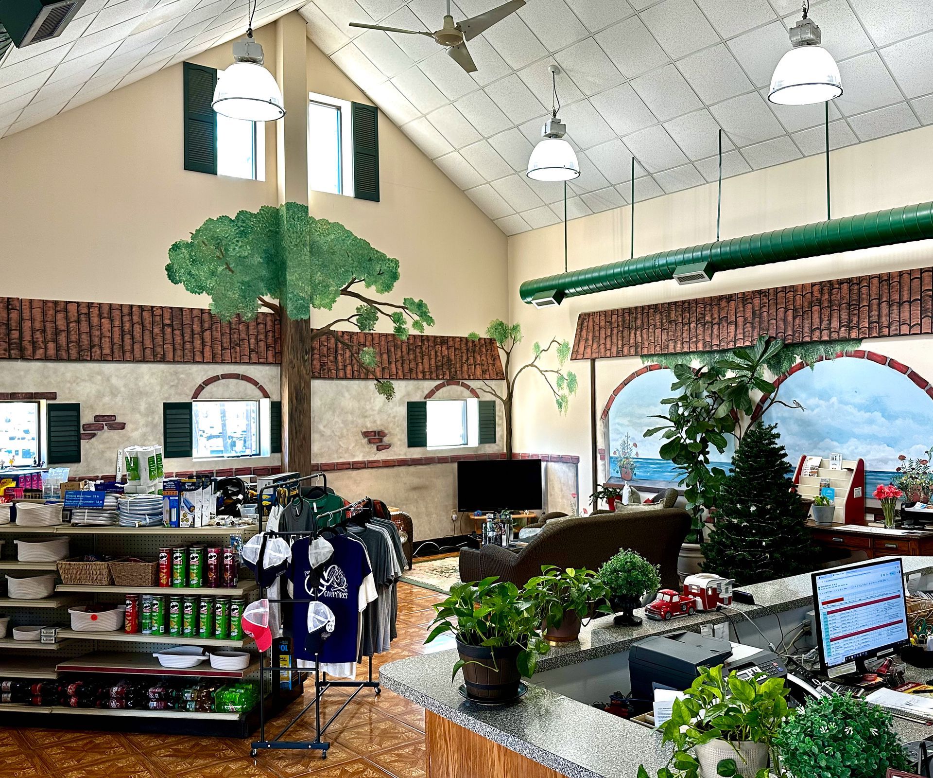 The inside of a store with a tree on the ceiling