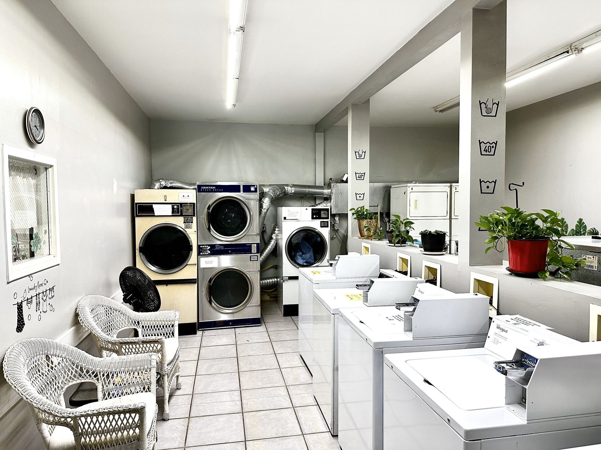 A laundromat with a lot of washers and dryers