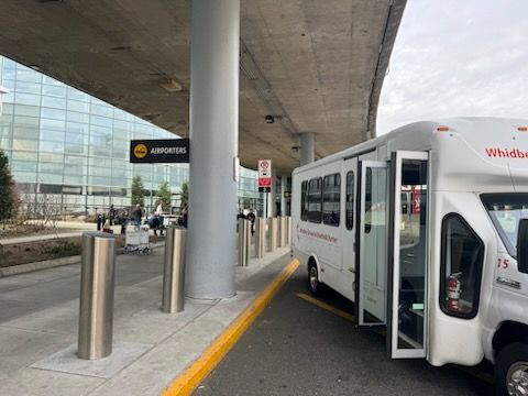 Whidbey SeaTac Shuttle at the SeaTac airport pickup curb