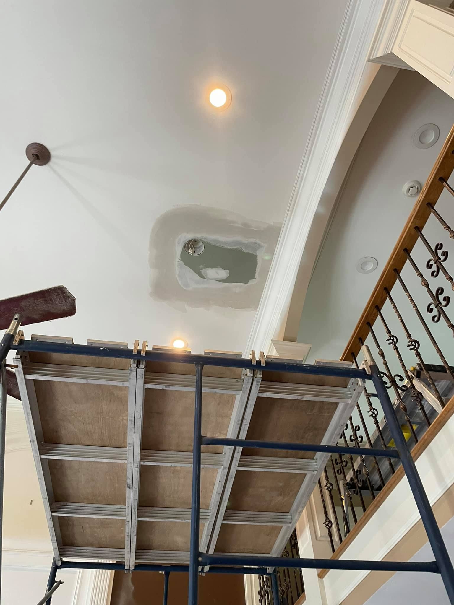 Large scaffolding next to a ceiling.