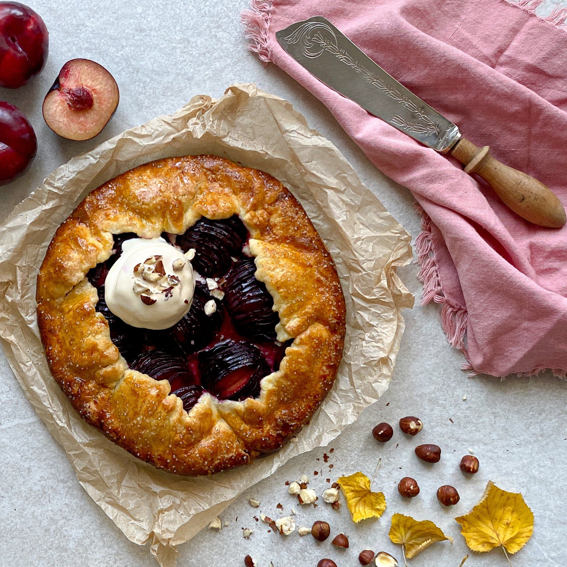 tart plums icecream hazelnuts knife