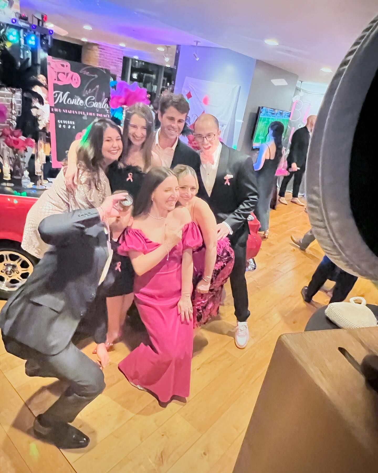 A bride and her bridesmaids are posing for a picture.