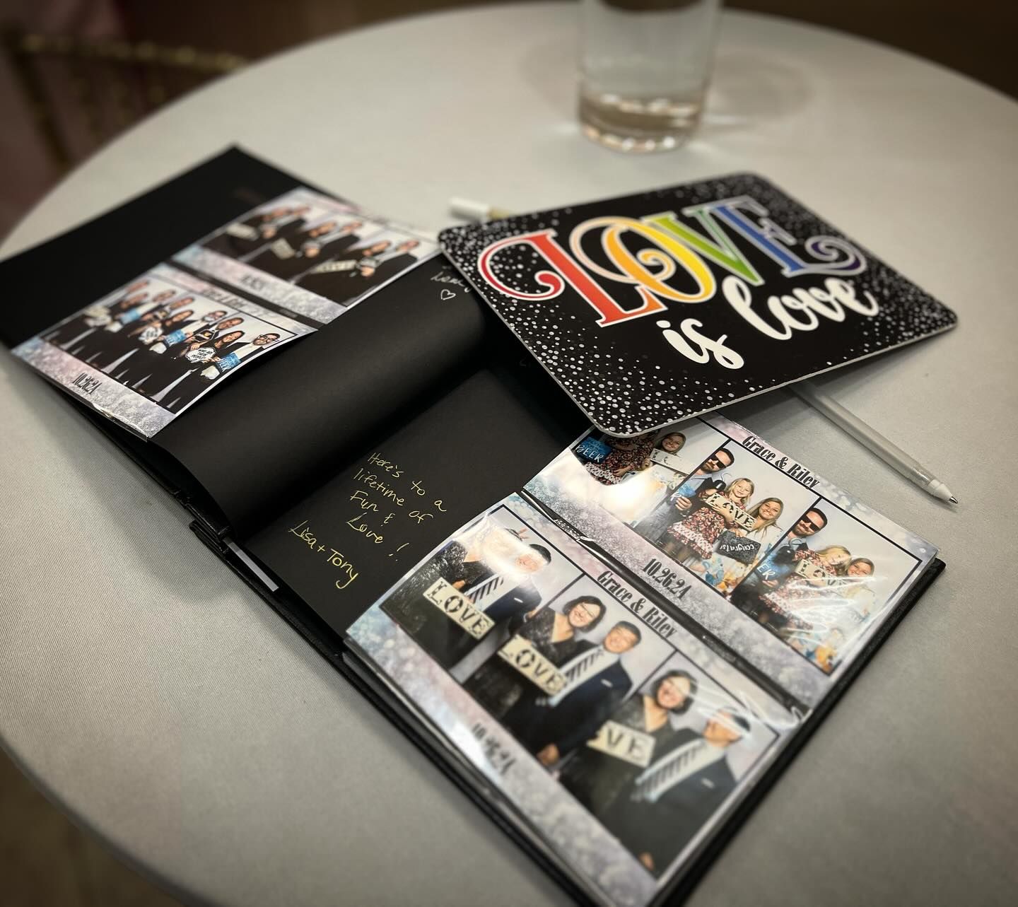 A group of people are posing for a picture in a photo booth.