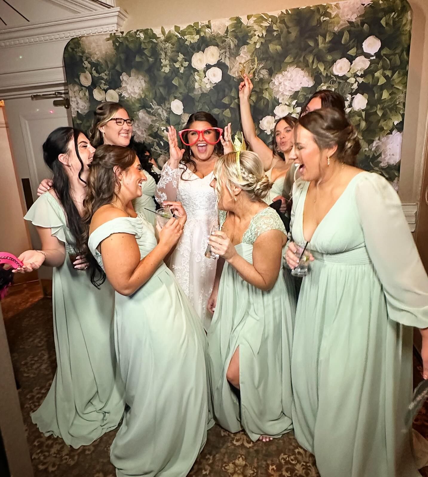 A group of people are posing for a picture in a photo booth.