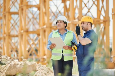 construction team standing in front of construction site