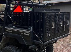 A kawasaki utility vehicle with an aluminum dog box.