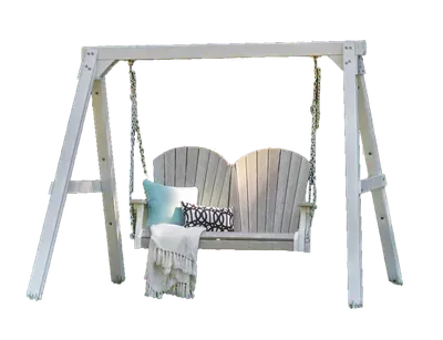 A white porch swing with a blanket and pillows on it.