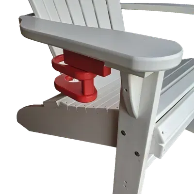 A white chair with a red cup holder on the arm