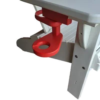 A white table with a red holder attached to it
