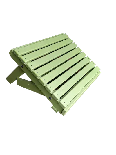 A green ottoman is sitting on a white surface.