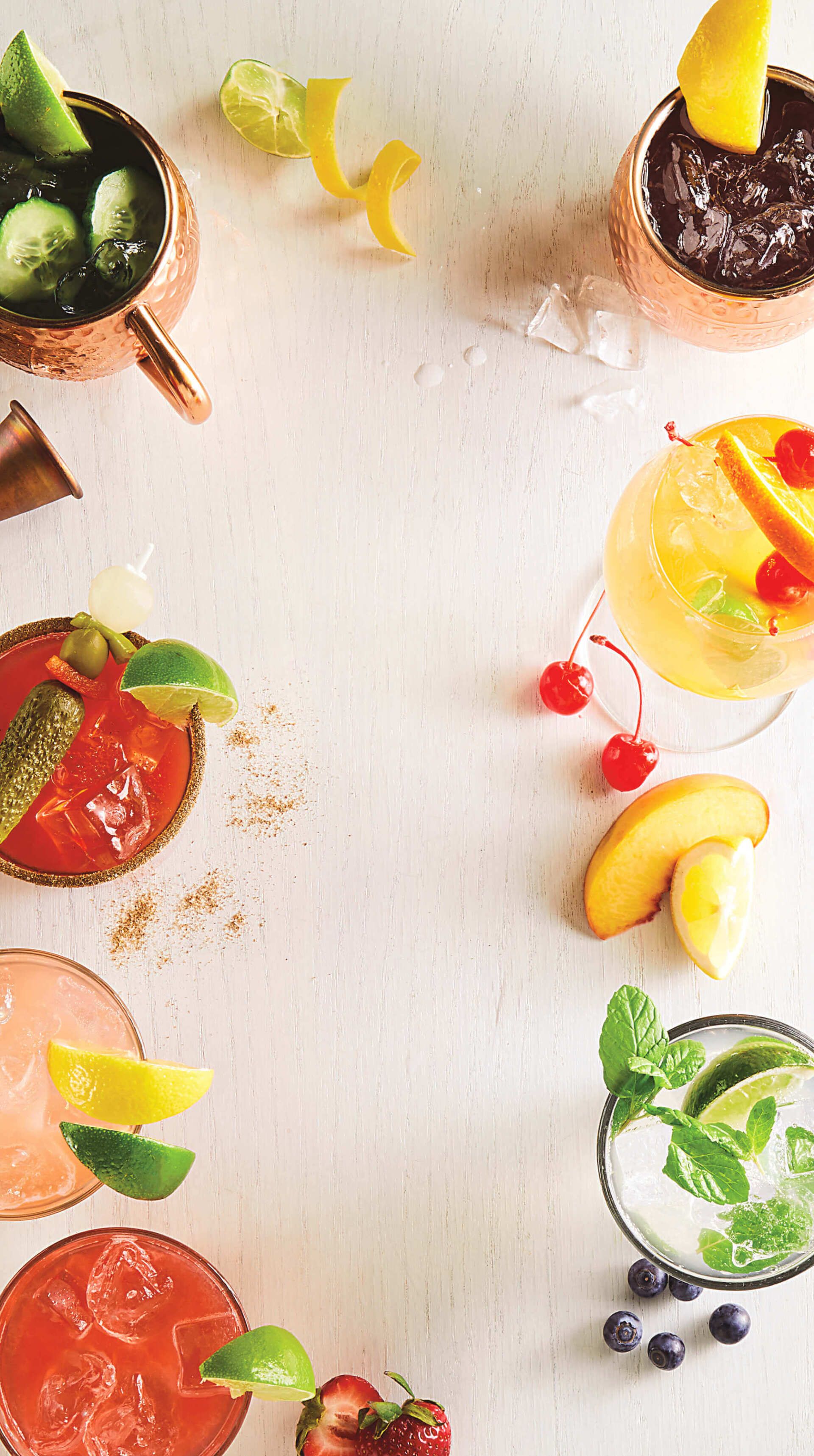 There are many different types of drinks on the table.