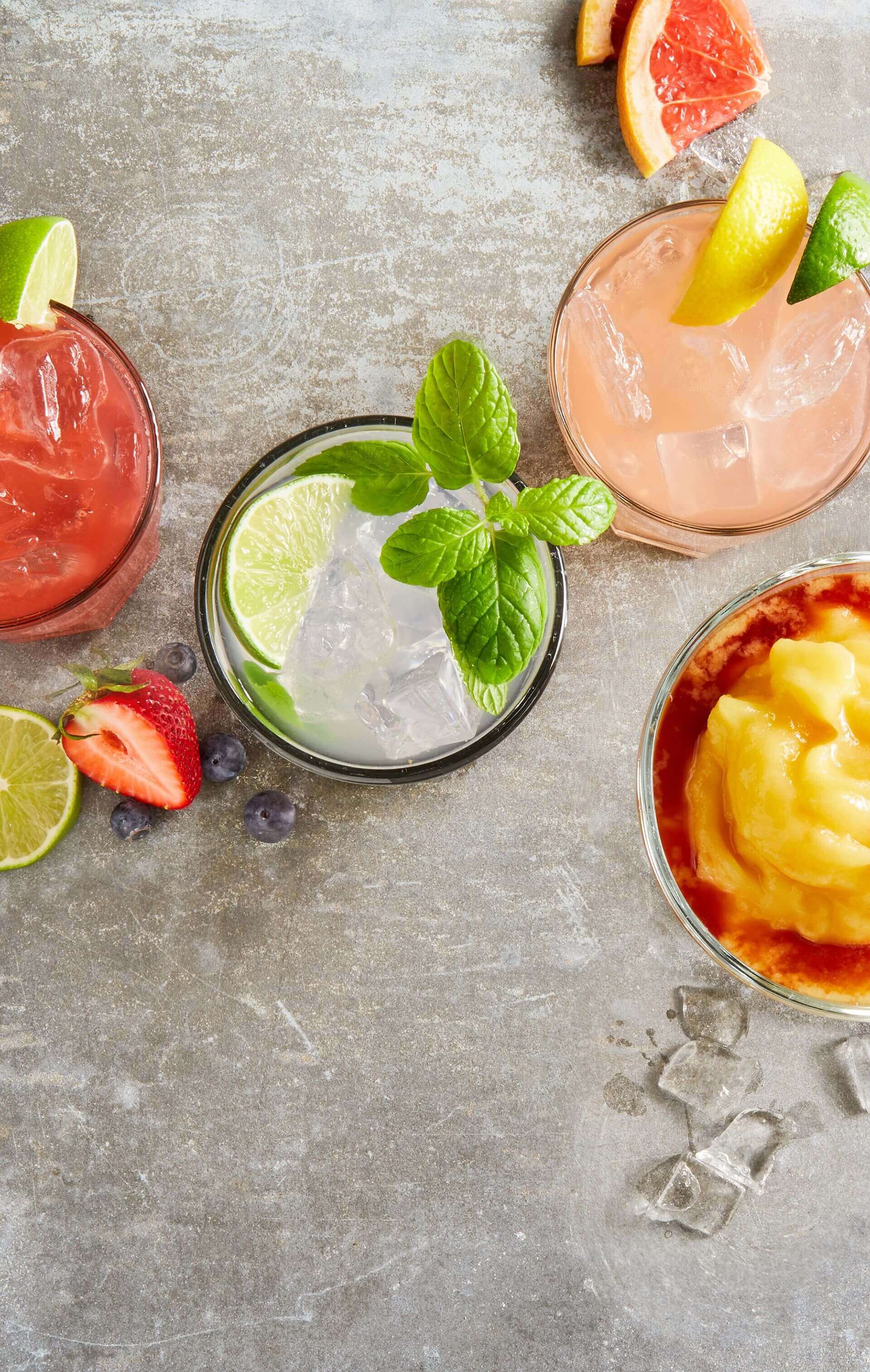 There are many different types of drinks on the table.