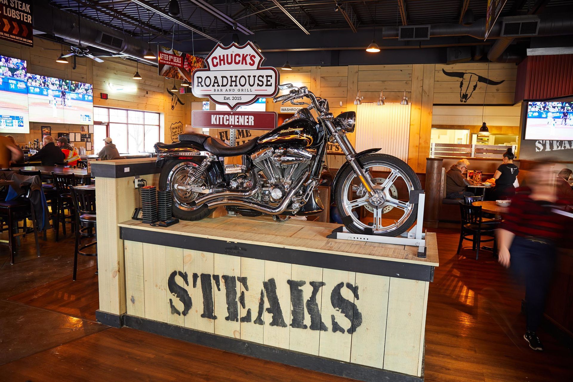 A motorcycle is on display in a restaurant