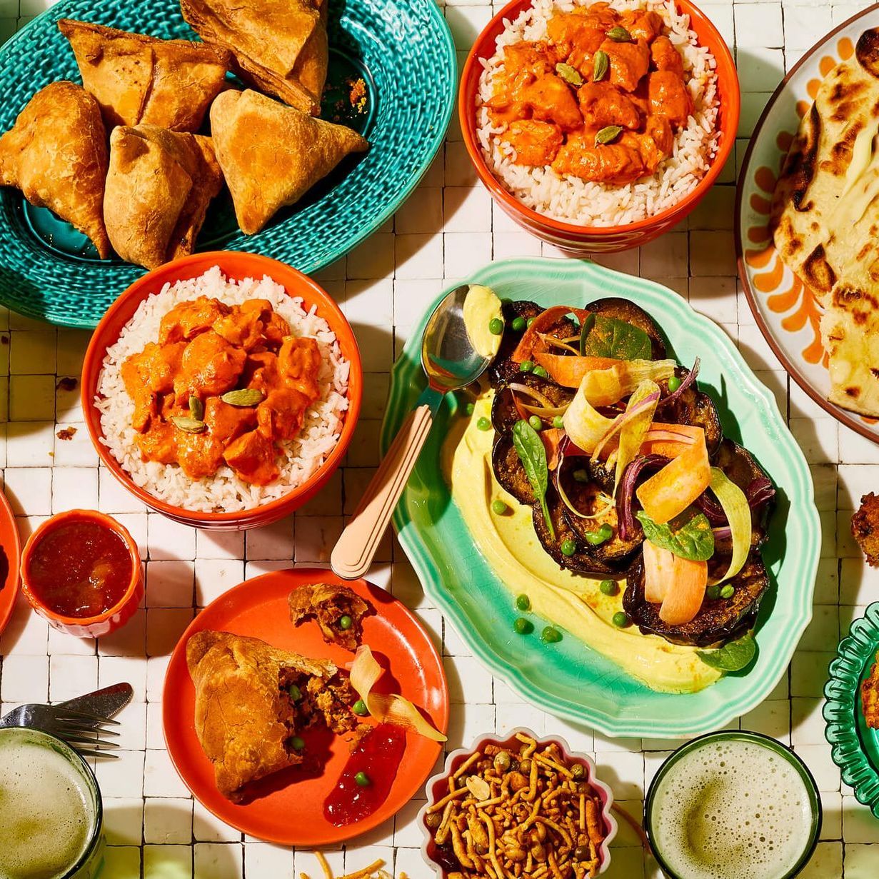 A table topped with plates of food and bowls of food.