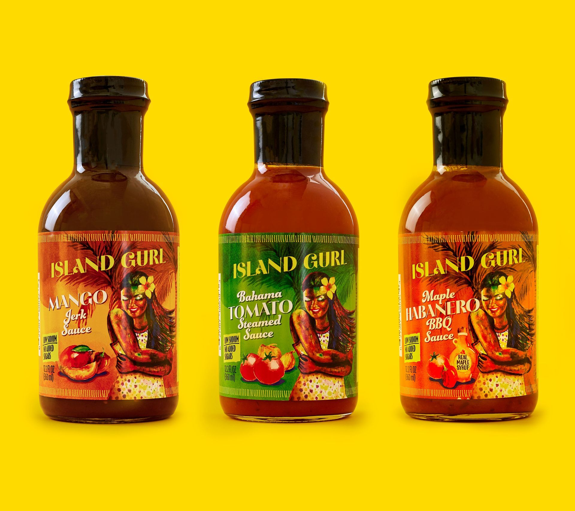 Three bottles of island girl sauce on a yellow background