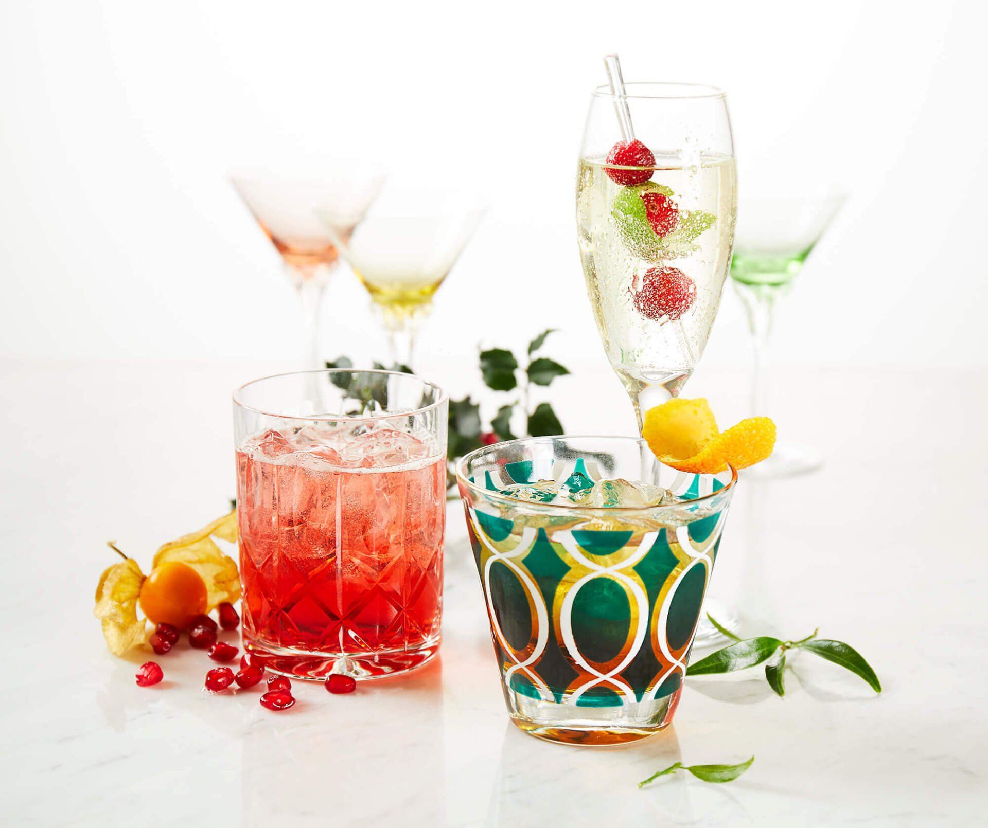 There are many different types of drinks in the glasses on the table.