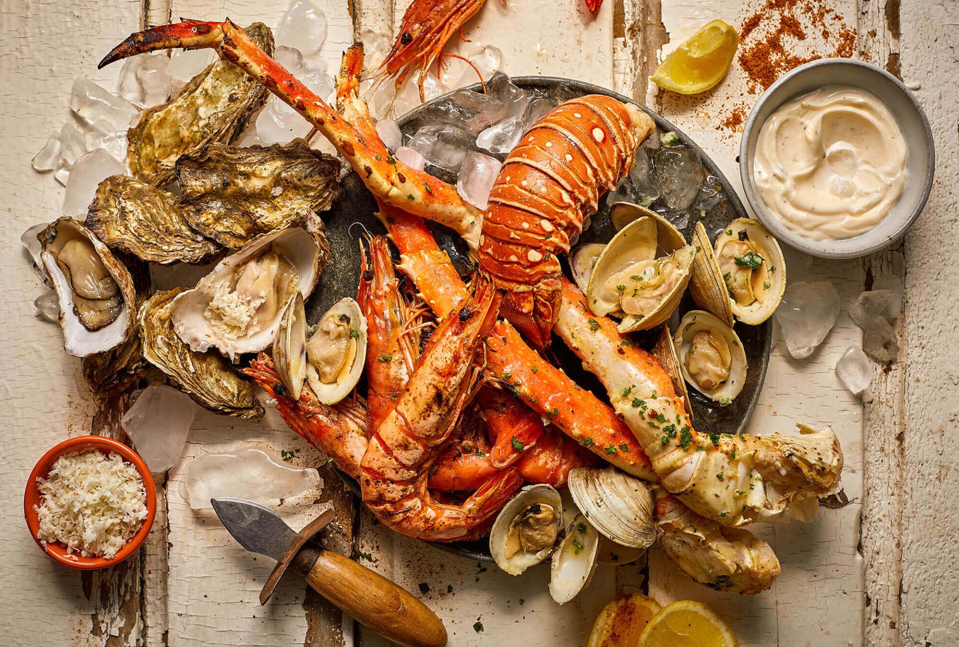 There are many different types of seafood on the table.