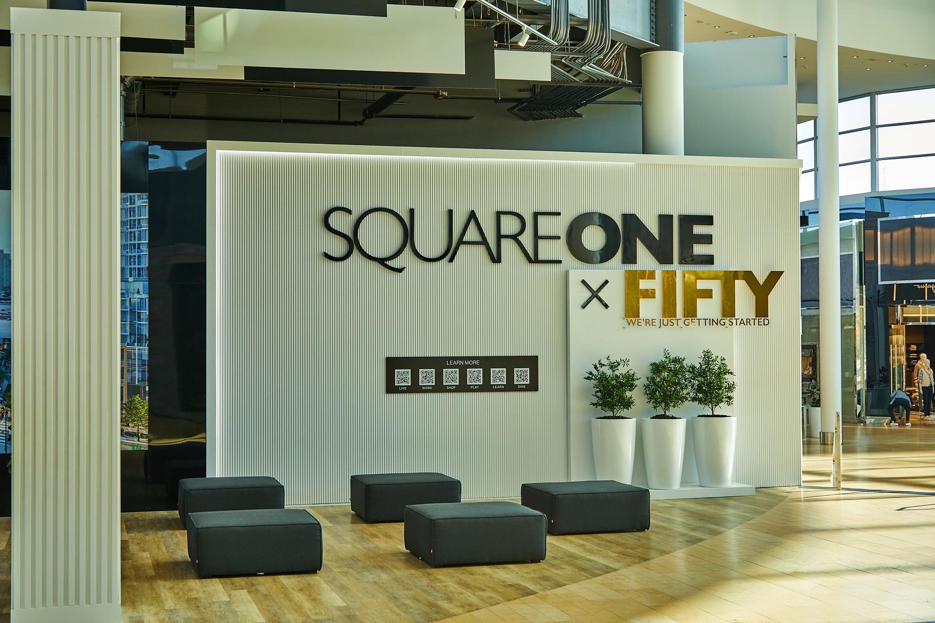 A room with a sign that says square one x fifty