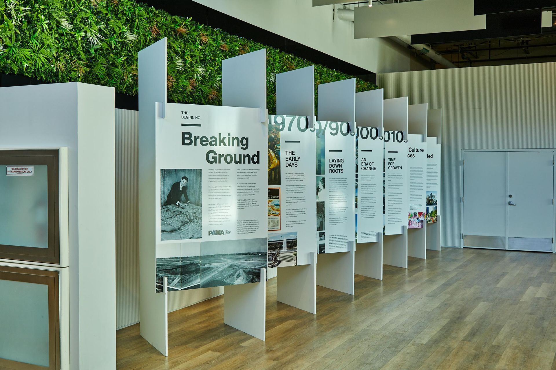 A room with a sign that says breaking ground