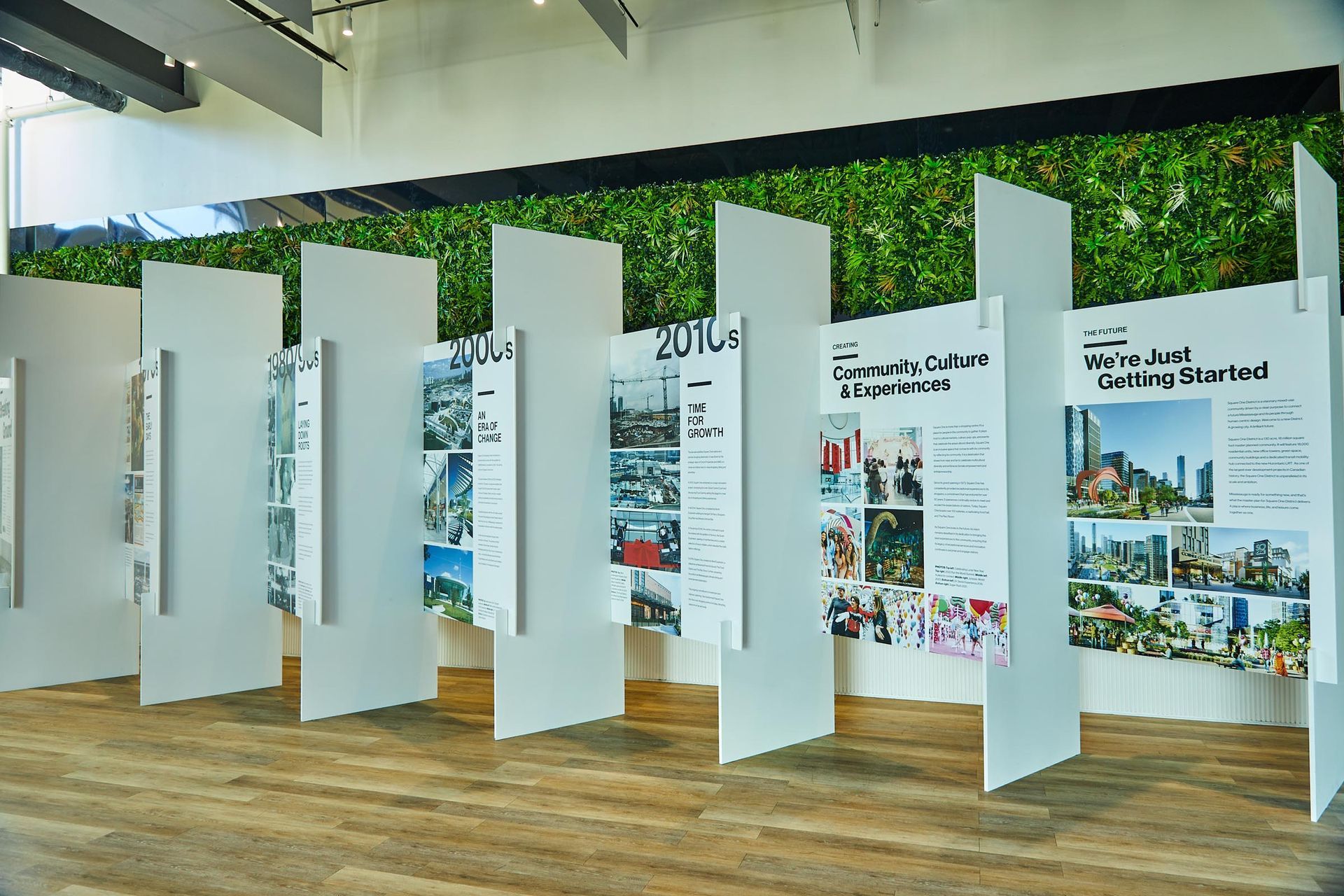 A room with a green wall and a lot of posters on the wall.