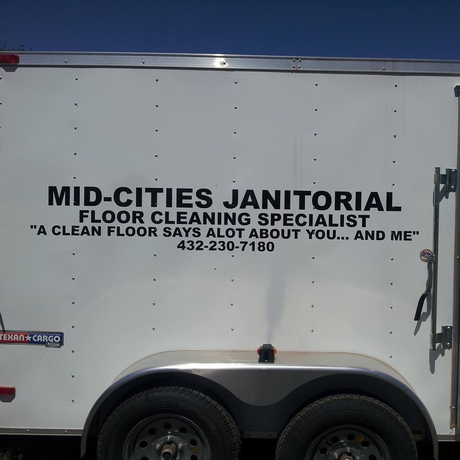 A white trailer that says mid-cities janitorial floor cleaning specialist