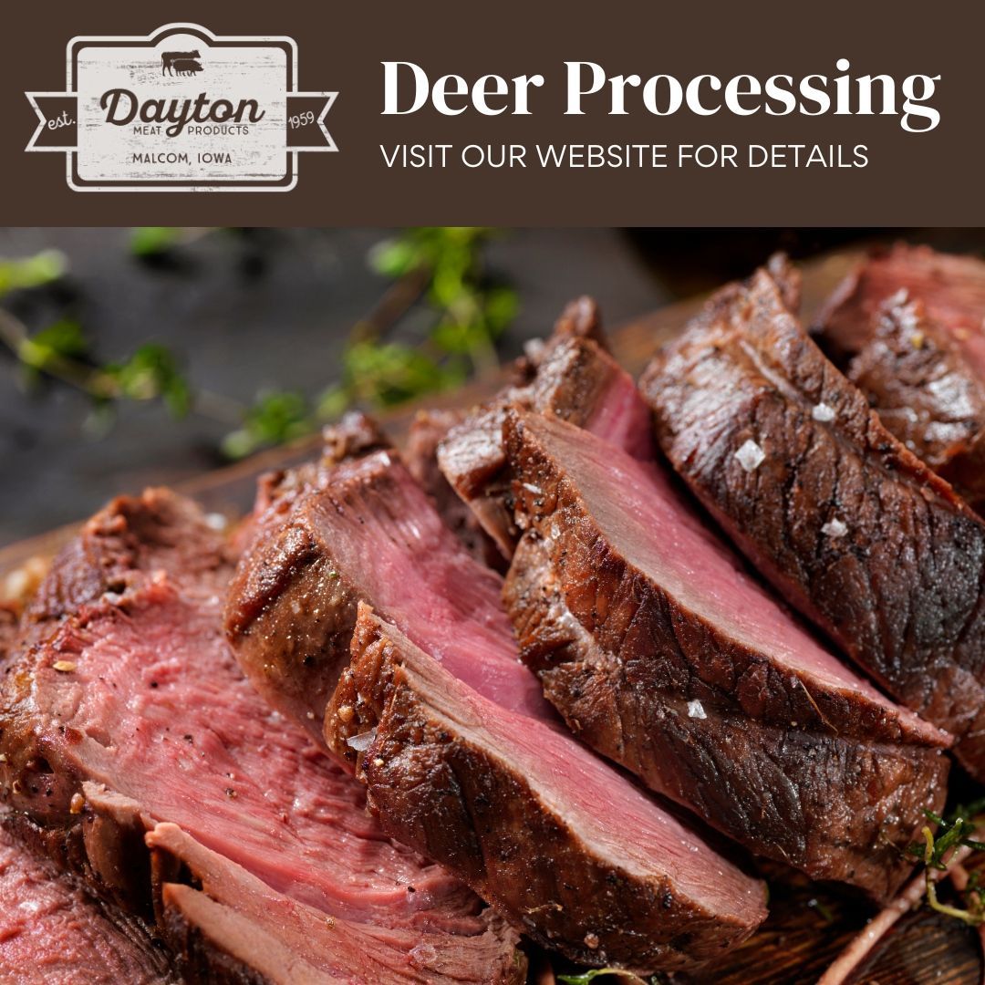 A close up of sliced deer meat on a cutting board.