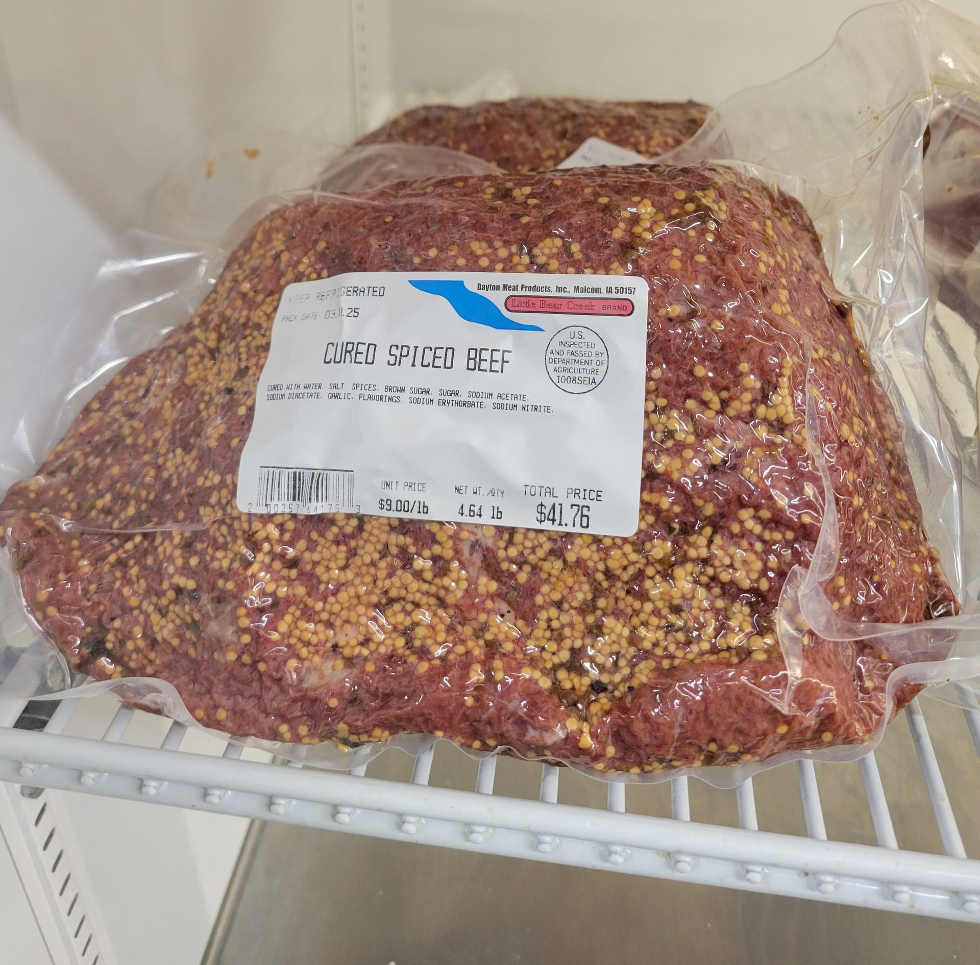 A bag of ground beef with a label that says ground spiced beef