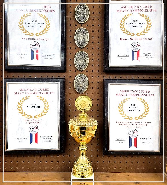 A trophy is surrounded by plaques that say american circled meat championships