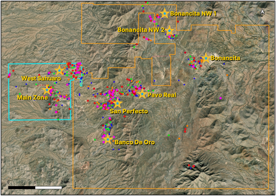 An aerial view of a mountain range with various colored stars