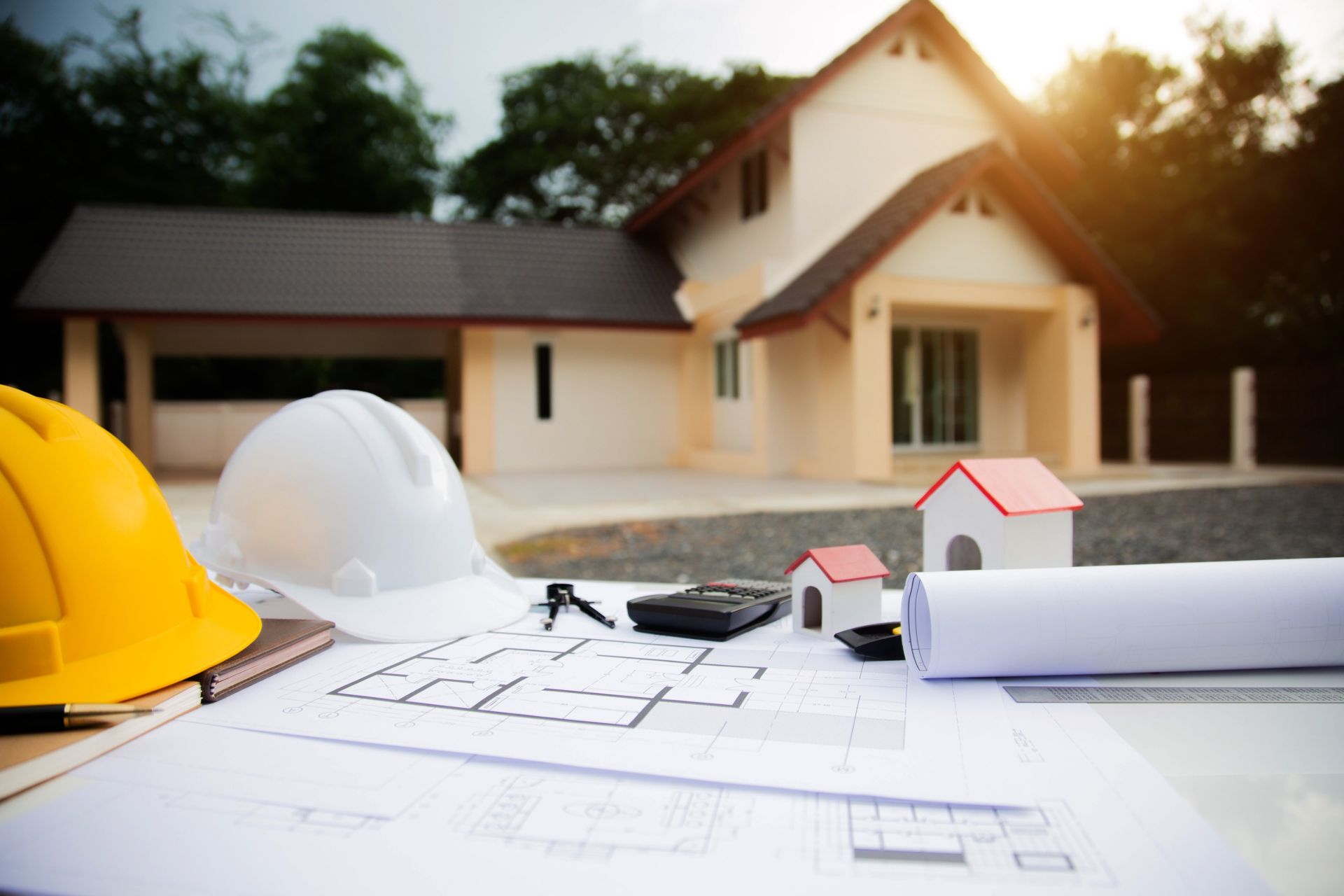 Table with plans  of a construction project done by a Custom Home Builder