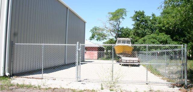 Garage Chain Link Fence — Yulee, FL — Creative Services & Fence Company Inc.