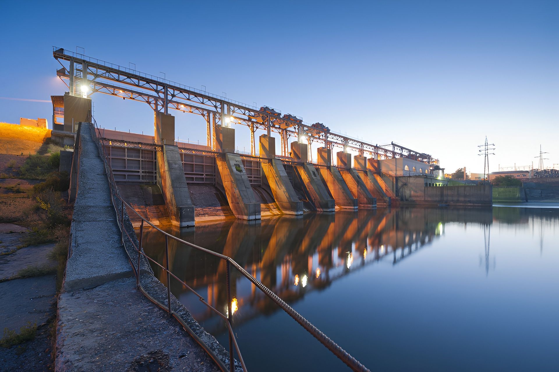 Concrete Dam at Dusk Reflecting in Still Water — BC Earthmoving and Tipper Hire in Sunshine Coast, QLD