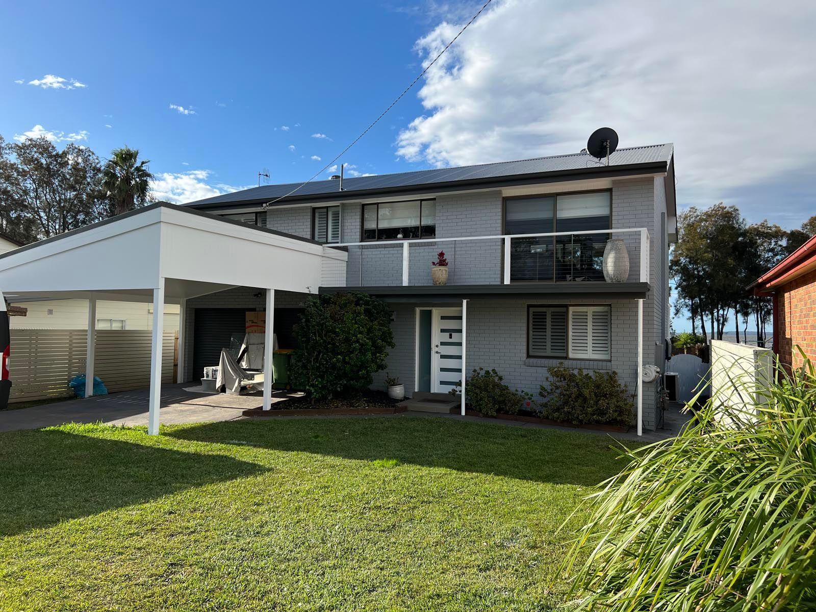 Exterior weatherboard home with fresh paint and clean lines