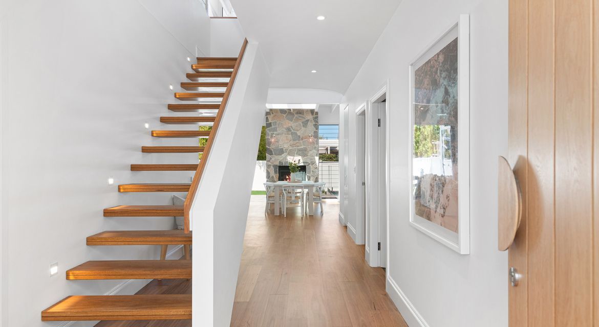 Crisp white hallway with newly painted doors and trims