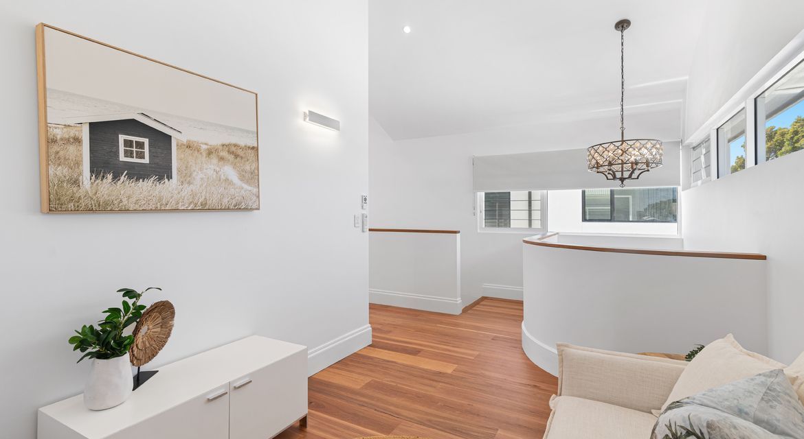Home office with calming green painted walls and natural light