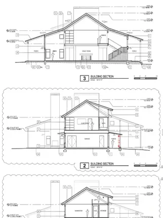 A black and white drawing of a house cut in half.