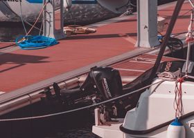 Boats docked at a Florida marina with shore power pedestals along the pier