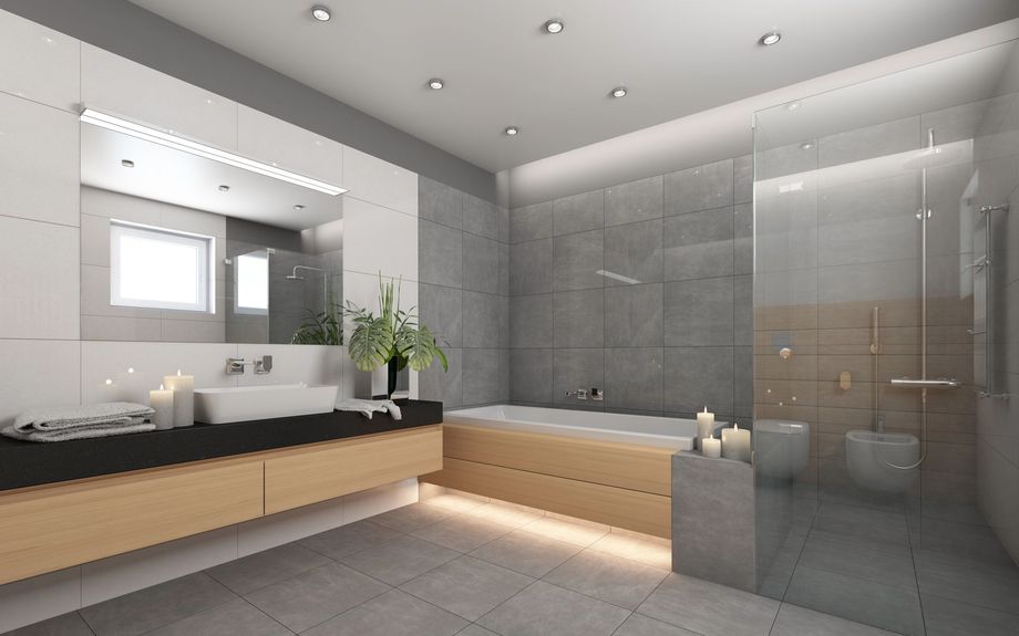 Bagno moderno con doppio lavabo, specchio illuminato, mobili in legno e doccia con box in vetro.