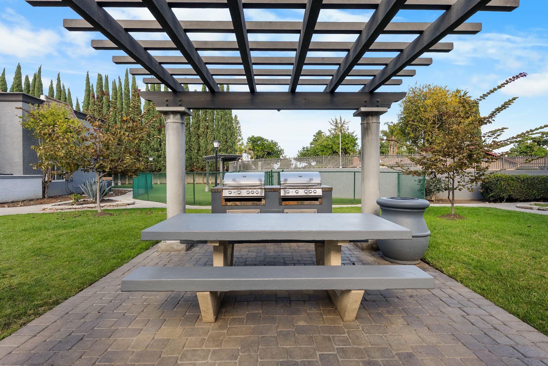Park Plaza BBQ grills and picnic table