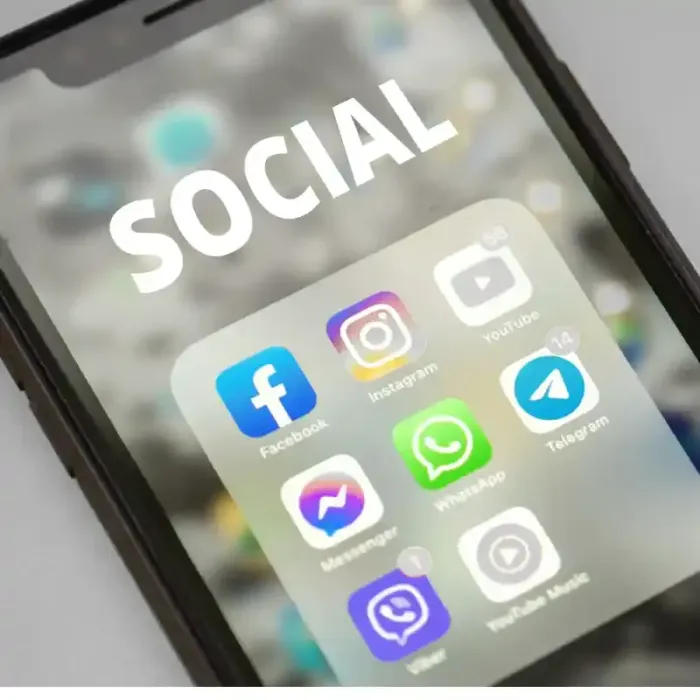 A cell phone with the word SOCIAL at the top showing different social media apps such as Facebook, Instagram, Youtube, Messenger, WhatsApp, Telegram, Viber and Youtube Music