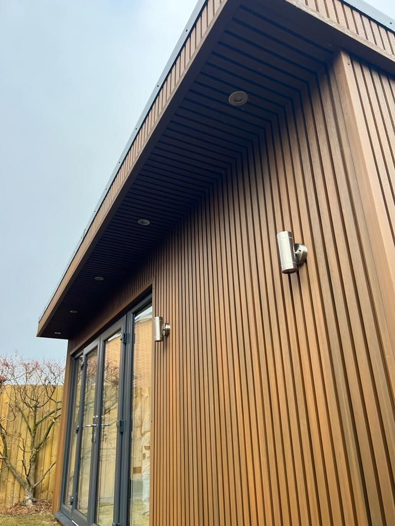 a garden building with a roof that has a roof light on it