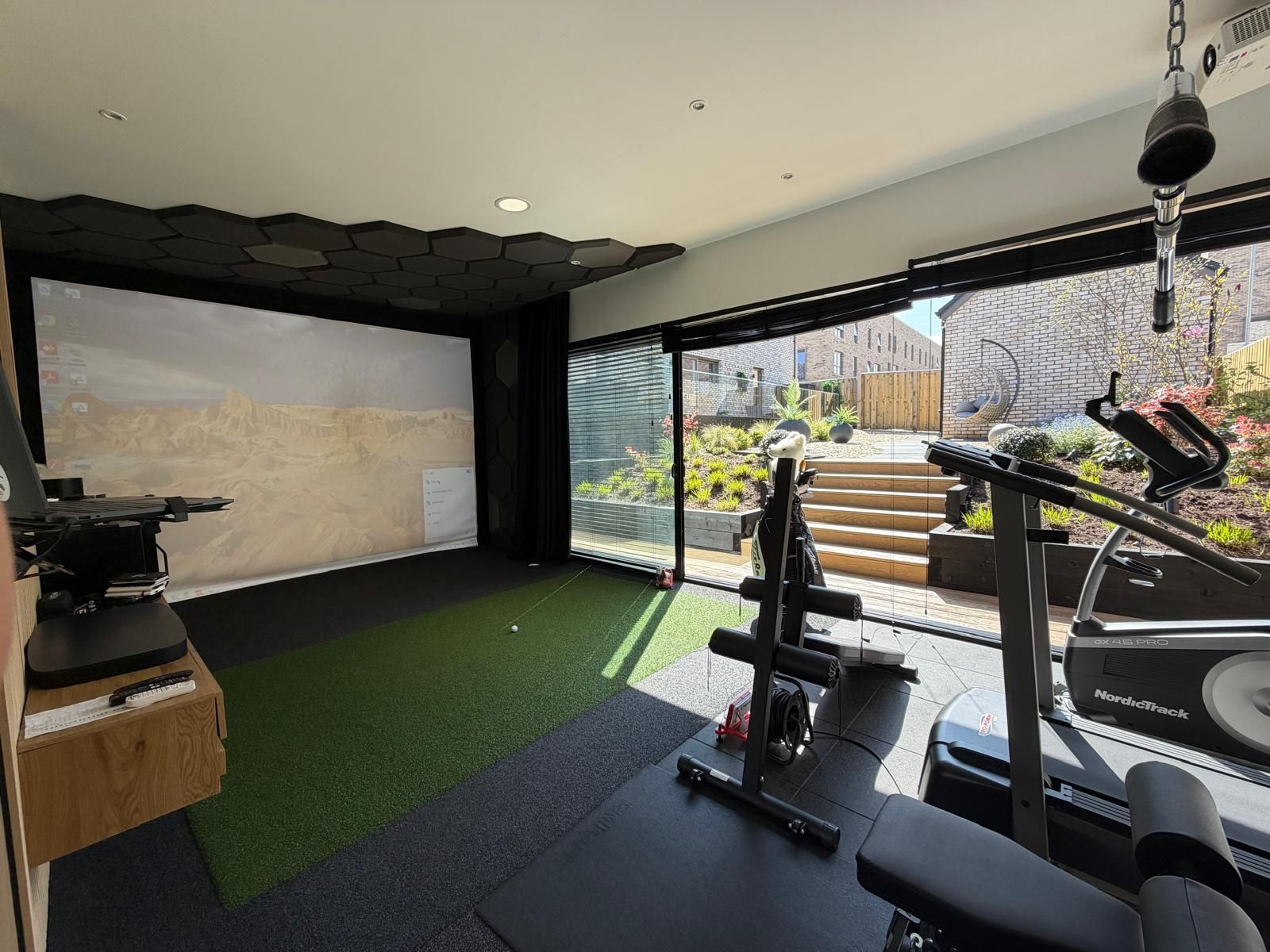 Oakspan golf simulator room interior with premium finish and practice area