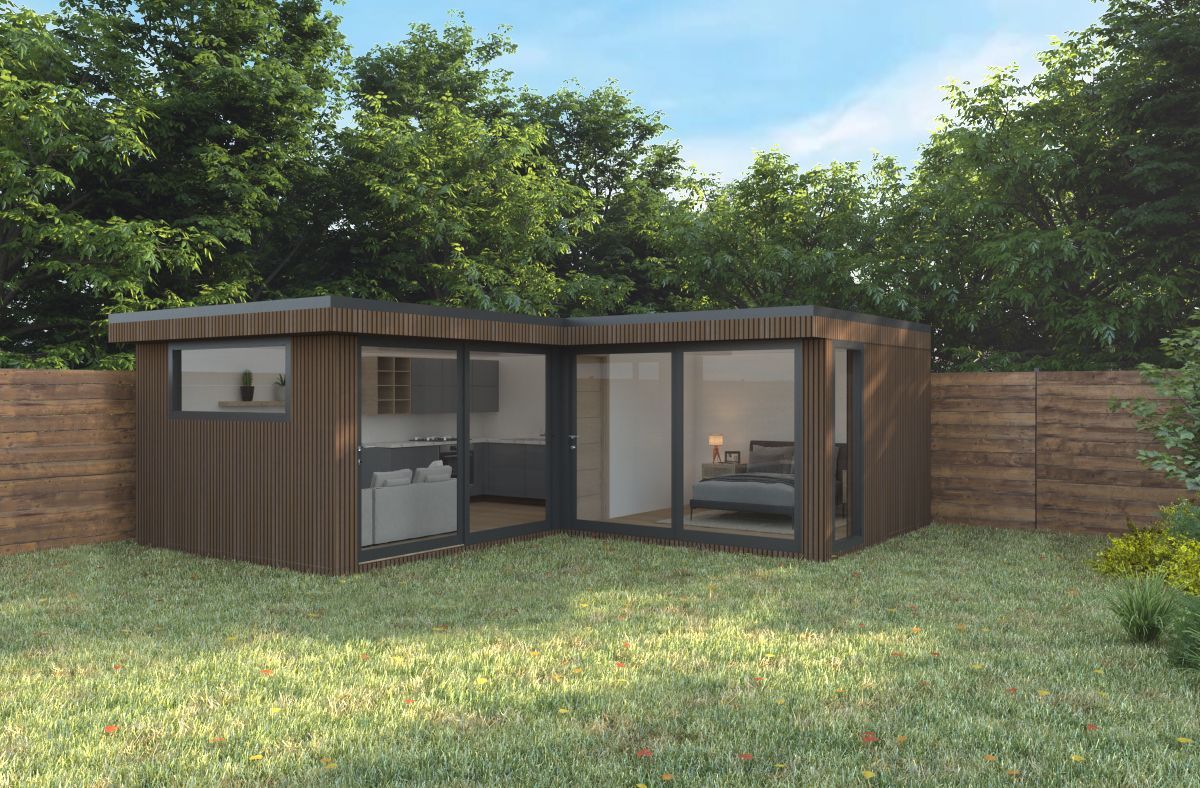 a corner garden room annexe with a bedroom and a kitchen in the backyard
