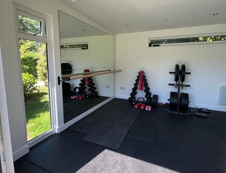 A garden room with a gym, perfect for creating a functional and motivating space
